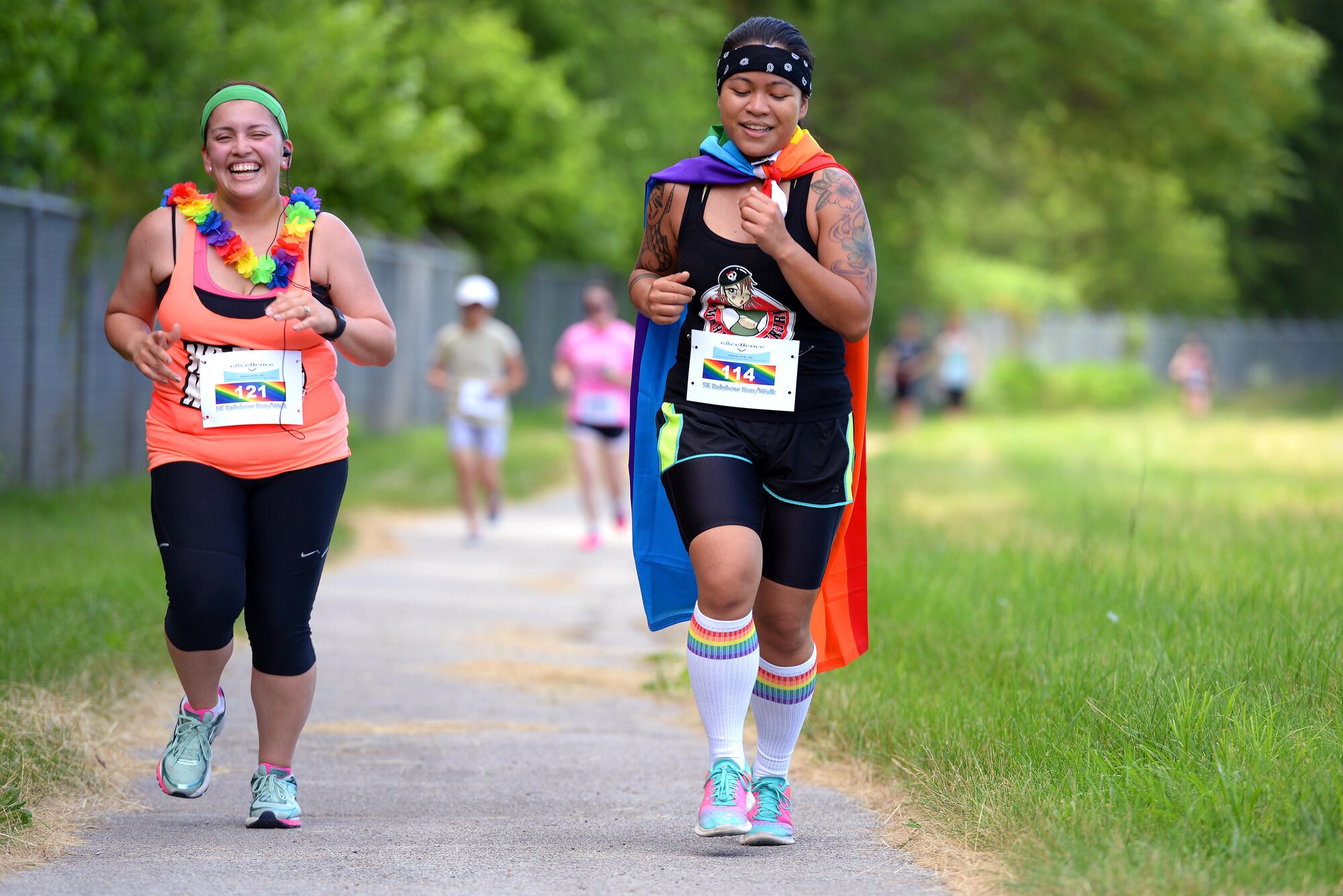 Staff Sgt. Diane Balmer, left, 55th Force Support Squadron, and Hazael Policarpio, 49th Intelligence Squadron, participate in the Rainbow 5K Run/Walk June 23 at Offutt Air Force Base, Neb. The event was held as part of LGBT pride month to celebrate diversity among DOD members. (U.S. Air Force photo by Delanie Stafford/Released)