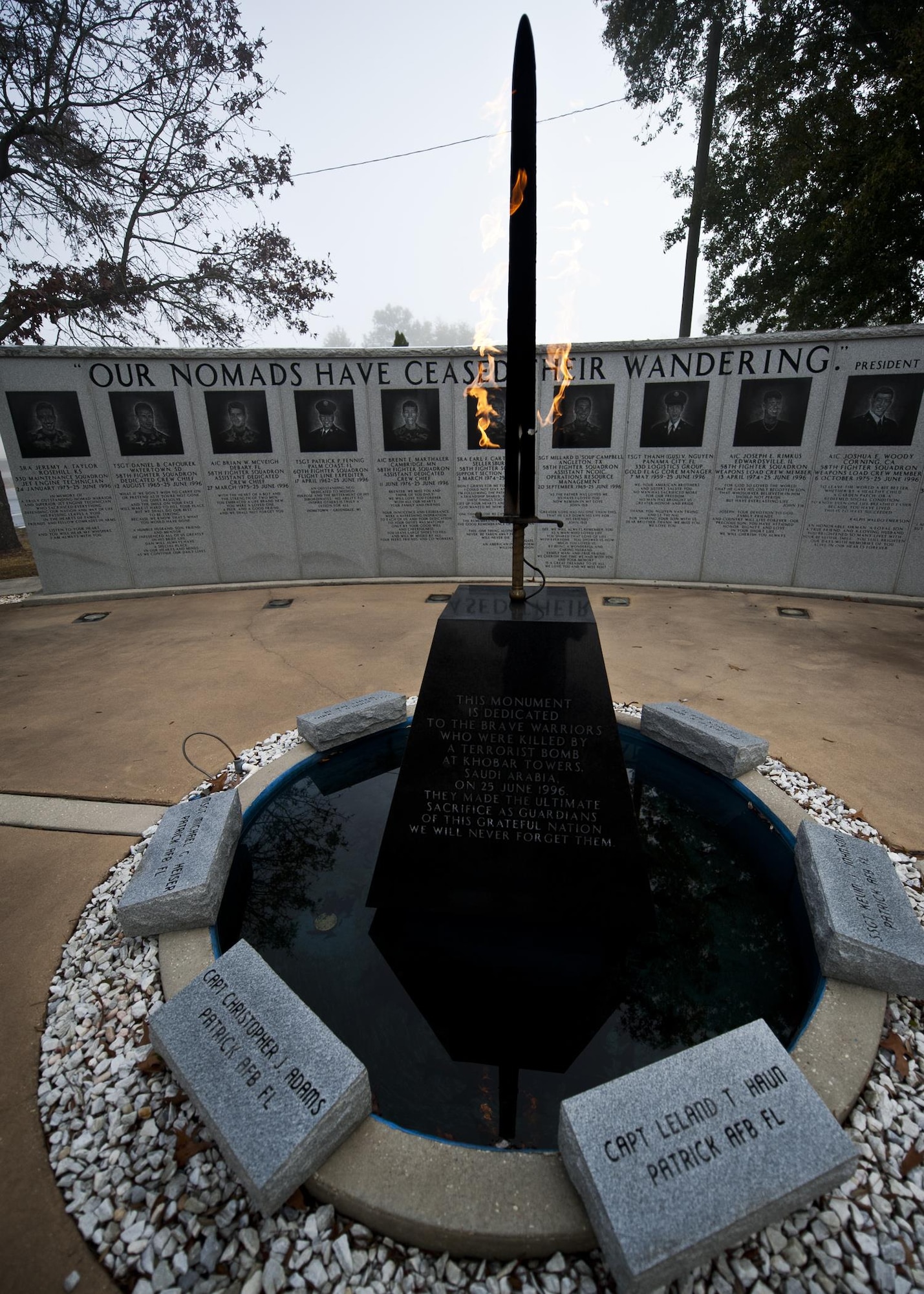 The fiery sword at the center of the Nomad Memorial burns bright through the foggy morning Feb. 18, 2011, at Eglin Air Force Base, Fla. The memorial was constructed to honor the hundreds of wounded personnel and 19 Airmen who lost their lives during the Khobar Towers bombing on June 25, 1996. (U.S. Air Force photo/Samuel King Jr.)