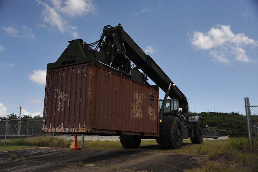 The 390th SPOC Soldiers moved 11,000-pound containers onto the LCM by utilizing a Rough Terrain Container Handler (RTCH). An RTCH can support up to 50,000lbs, even though it is not recommended.