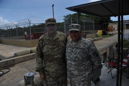 1st MSC, Commanding Sgt. Maj. Harry Muñoz., awards Staff Sgt. Gilberto Robles from the PRANG, LCD, with the 1st MSC Command Team coin for his excellent work as the LCM Captain.