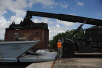 The 390th SPOC Soldiers moved 11,000-pound containers onto the LCM by utilizing a RTCH.