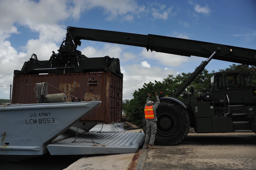 The 390th SPOC Soldiers moved 11,000-pound containers onto the LCM by utilizing a RTCH.