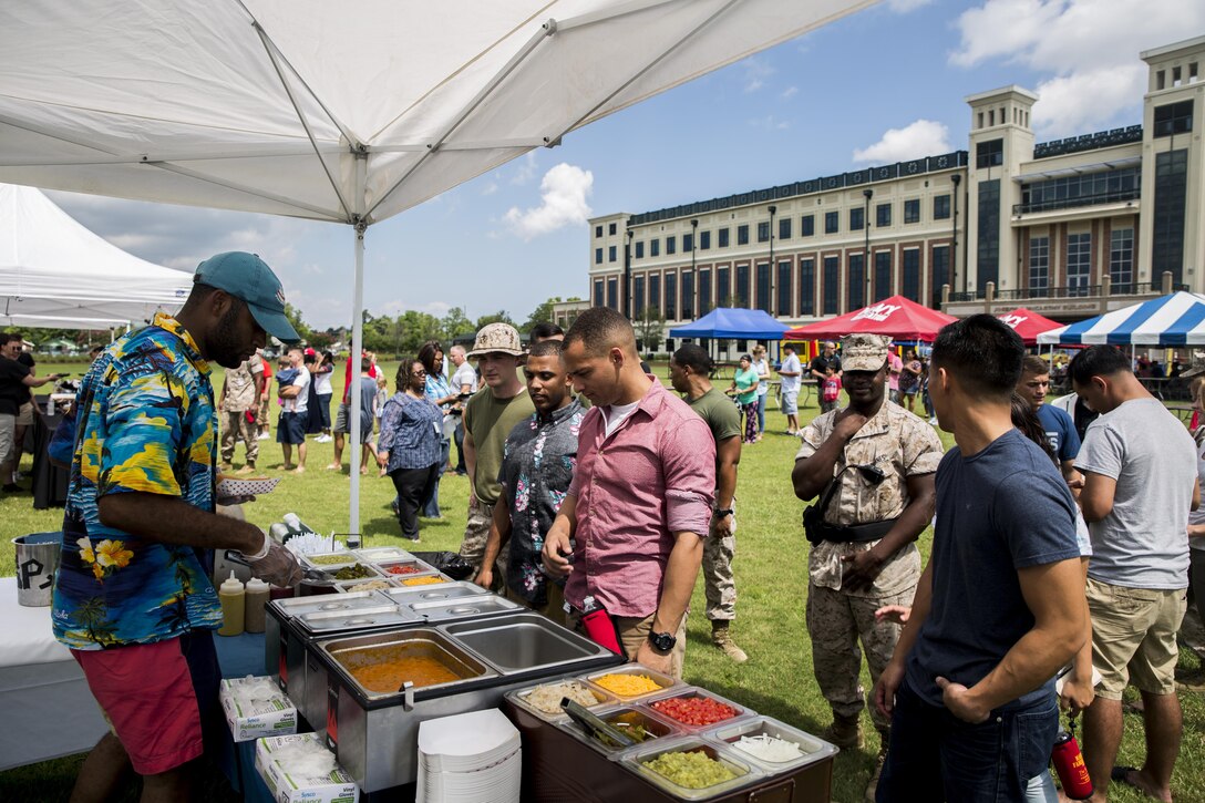 Marines, Sailors and family members of Marine Forces Reserve, enjoy food, fun, and festivities during Military Family Appreciation Day at Marine Corps Support Facility, New Orleans, June 24, 2016. 