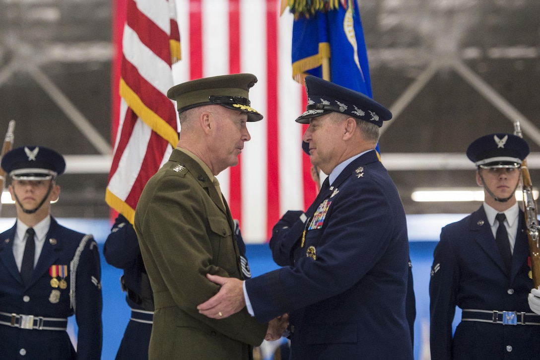 Marine Corps Gen. Joe Dunford, left, chairman of the Joint Chiefs of Staff, congratulates Air Force Chief of Staff Gen. Mark A. Welsh III during Welsh's retirement ceremony at Joint Base Andrews, Md., June 24, 20156. Commissioned as an Air Force officer in June 1976, Welsh became chief of staff in August 2012. DoD photo by Navy Petty Officer 2nd Class Dominique A. Pineiro