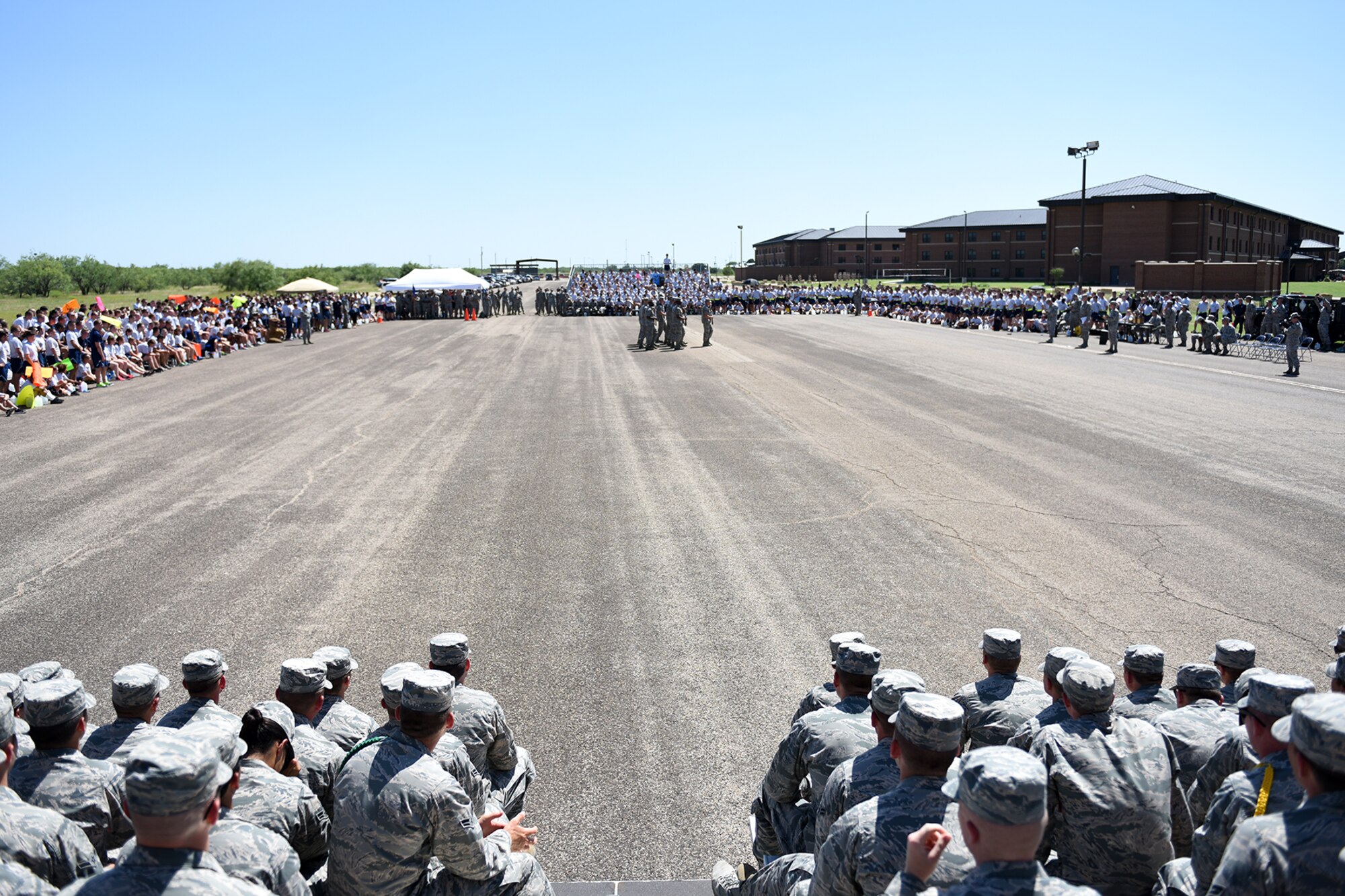 The 17th Training Group hosts a drill competition for the 312th, 315th and 316th training squadrons on the flight line at Goodfellow Air Force Base, Texas, June 22, 2016. Each squadron competed in multiple categories such as individual drill, regulation drill, exhibition drill and the spirit of the squadron during the competition. (U.S. Air Force photo by Airman 1st Class Caelynn Ferguson/Released)