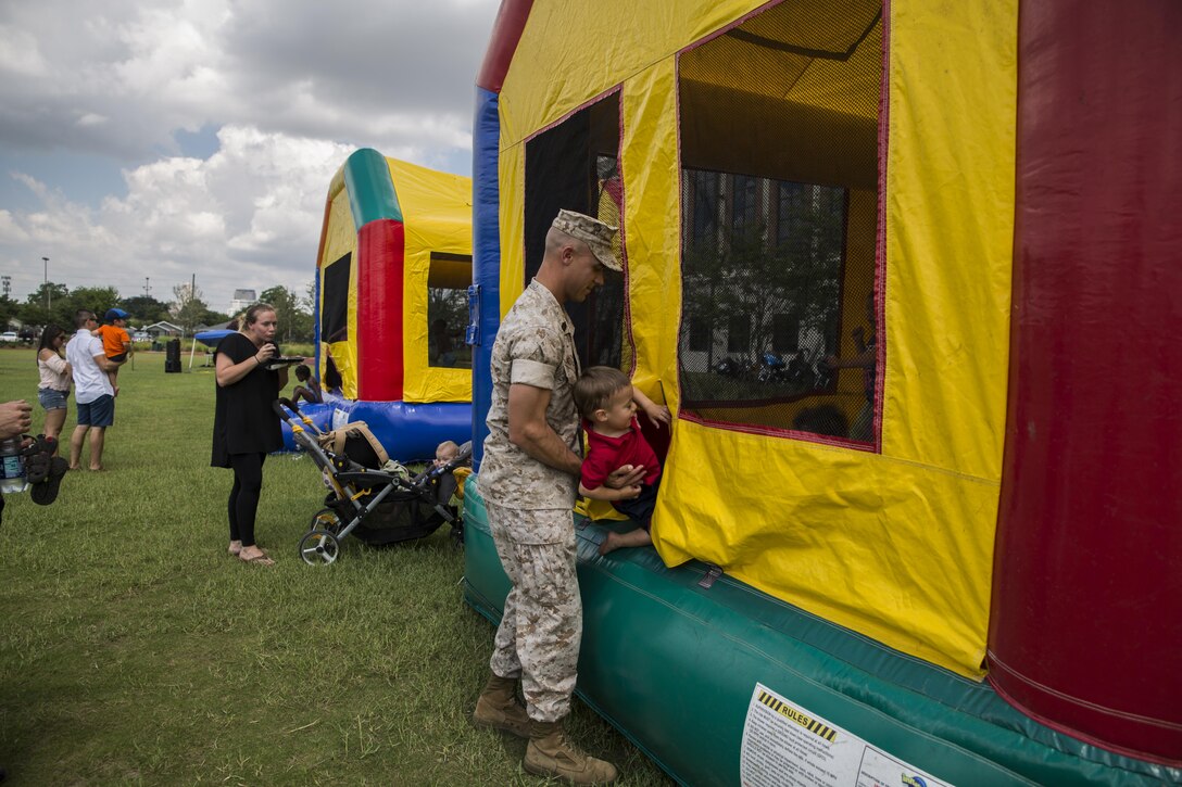 Marines, Sailors and family members of Marine Forces Reserve, enjoy food, fun, and festivities during Military Family Appreciation Day at Marine Corps Support Facility, New Orleans, June 24, 2016. 