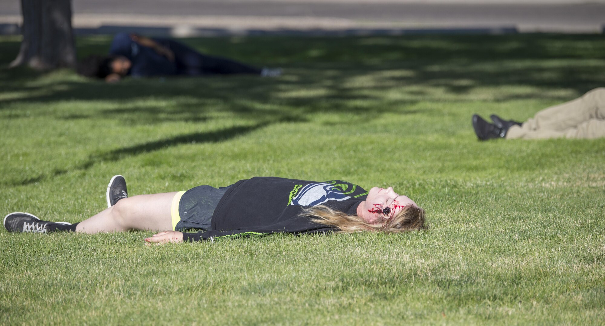 A military member poses as a downed victim during an active shooter exercise June 23, 2016, in downtown Mountain Home, Idaho. Mountain Home Air Force Base participated in an active shooter exercise lead by Mountain Home law enforcement. (U.S. Air Force photo by Senior Airman Jeremy L. Mosier/Released)
