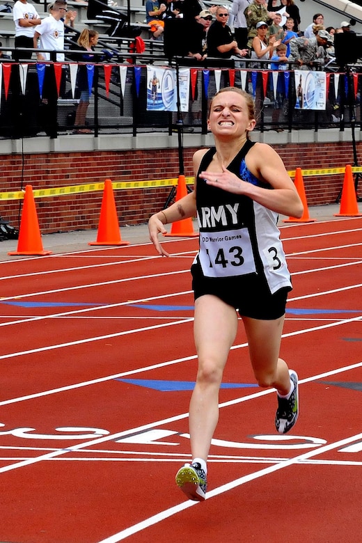 U.S. Army Reserve Staff Sgt. Megan Grudzinski, from Strongsville, Ohio, crosses the finish line for a first-place finish well ahead of the second place runner during the 800-meter event at the Track portion of the 2016 Department of Defense Warrior Games held at the U.S. Military Academy at West Point, New York, June 16. The DoD Warrior Games, June 15-21, is an adaptive sports competition for wounded, ill and injured service members and Veterans. (U.S. Army photo by Master Sgt. D. Keith Johnson/Released)