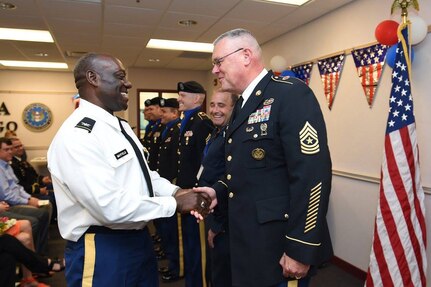 Col. D.D. Mayfield, left, commander of the Defense Contract Management Agency-Chicago, shakes hands with Sergeant Maj. James Rogers, G3/Operations Sergeant Major, after a change of command ceremony where Mayfield relinquished command to Col. Paul Mazure, June 23, 2016. Soldiers assigned to the 85th Support Command assisted with color guard support to DCMA.
(Photo by Mr. Anthony L Taylor)