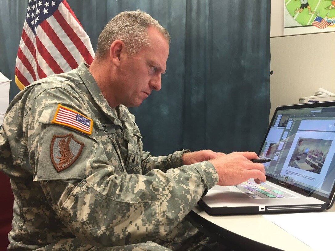 Army Reserve Spc. David LIetz, public affairs specialist, finalizes photo captions for a story during the command's battle assembly weekend, June 4, 2016.
(Photo by Sgt. 1st Class Anthony L. Taylor)