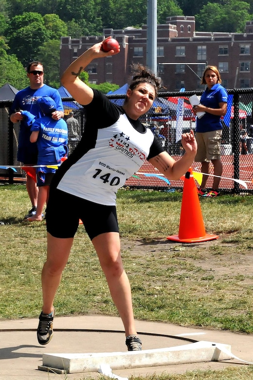 U.S. Army Spc. Sydney Davis, from the Warrior Transition Battalion, Fort Belvoir, Virginia, throws a shot put during the Field portion of the 2016 Department of Defense Warrior Games held at the U.S. Military Academy at West Point, New York, June 16. The DoD Warrior Games, June 15-21, is an adaptive sports competition for wounded, ill and injured service members and Veterans. (U.S.   Army photo by Master Sgt. D. Keith Johnson/Released)