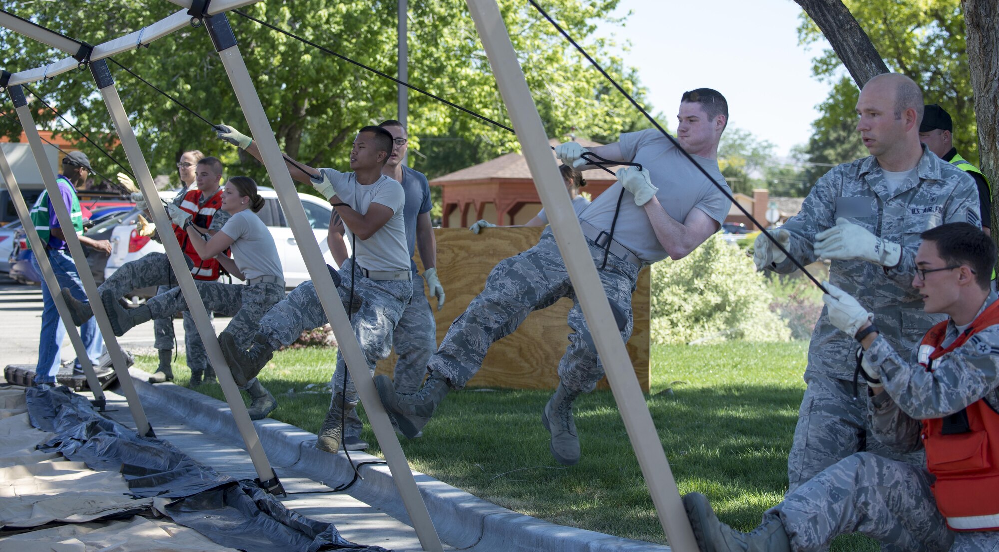 Members of the 366th Medical Group set up a tent for injured victims during an active shooter exercise June 23, 2016, in downtown Mountain Home, Idaho. The tent was setup to provide a safe location for the injured.(U.S. Air Force photo by Senior Airman Jeremy L. Mosier/Released)