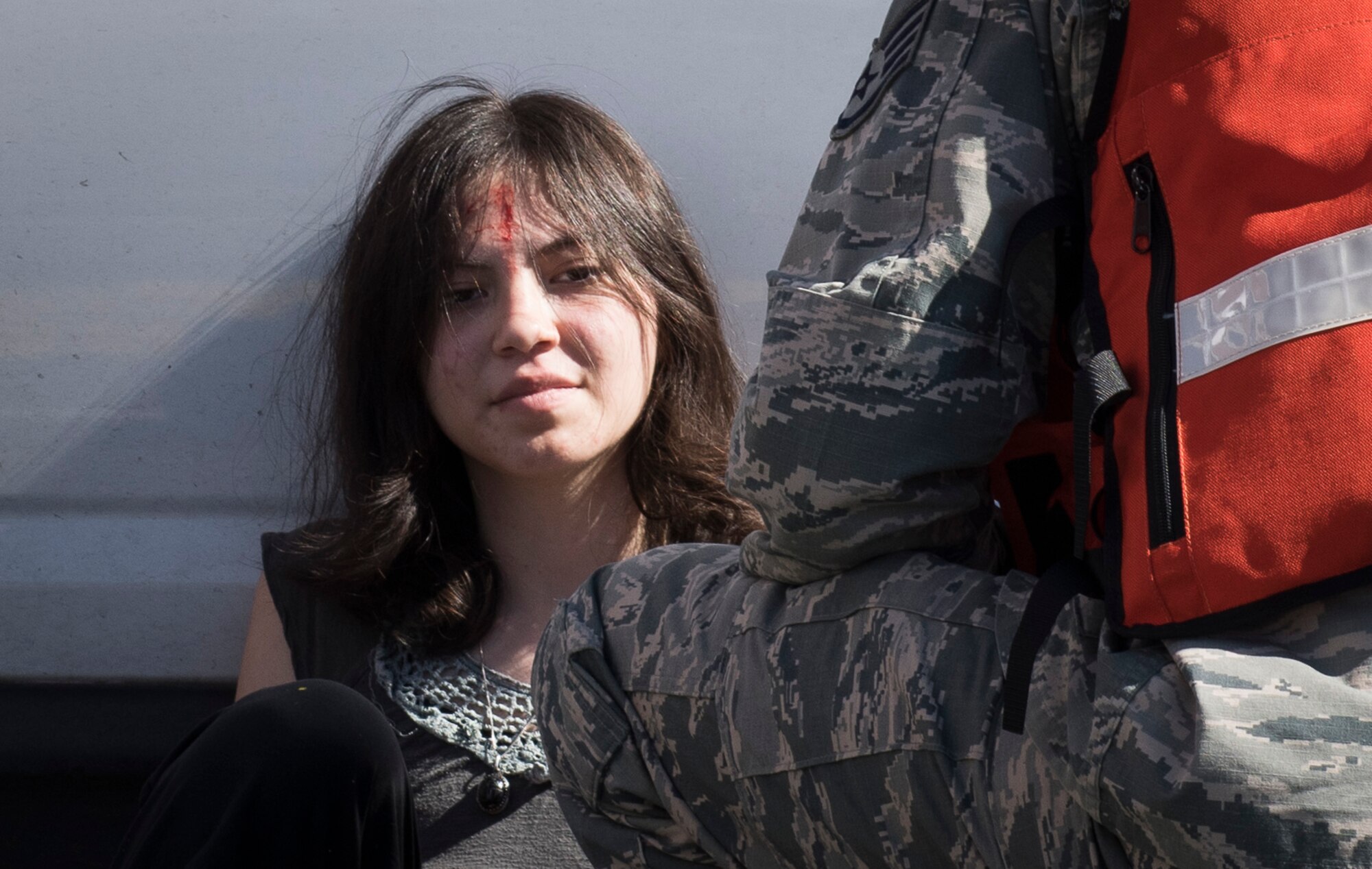 A 366th Medical Group member assesses a participant in an active shooter exercise June 23, 2016, in downtown Mountain Home, Idaho. Participants played a variety of roles that tested first responders in how they would react.(U.S. Air Force photo by Senior Airman Jeremy L. Mosier/Released)