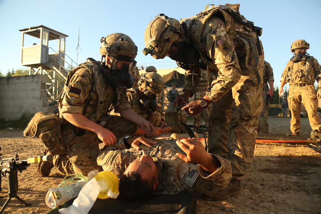 British soldiers strap a U.S. soldier to a litter during a medical evacuation simulation as part of the Swift Response 16 training exercise at Hohenfels Training Area in Hohenfels, Germany, Jun. 23, 2016. More than 5,000 service members from 10 countries are participating in the exercise. Following yesterday’s historic decision by voters in the United Kingdom to withdraw from the European Union, Defense Secretary Ash Carter spoke by telephone June 24 with his U.K. counterpart, Defense Secretary Michael Fallon. Carter emphasized that the U.S. and the U.K. will always enjoy a special relationship that’s reflected in the two nations’ close defense ties, Pentagon Press Secretary Peter Cook said in a readout of the call. Army photo by Spc. Nathaniel Nichols