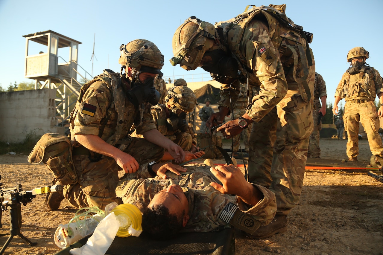 British soldiers strap a U.S. soldier to a litter during a medical evacuation simulation as part of the Swift Response 16 training exercise at Hohenfels Training Area in Hohenfels, Germany, Jun. 23, 2016. More than 5,000 service members from 10 countries are participating in the exercise. Following yesterday’s historic decision by voters in the United Kingdom to withdraw from the European Union, Defense Secretary Ash Carter spoke by telephone June 24 with his U.K. counterpart, Defense Secretary Michael Fallon. Carter emphasized that the U.S. and the U.K. will always enjoy a special relationship that’s reflected in the two nations’ close defense ties, Pentagon Press Secretary Peter Cook said in a readout of the call. Army photo by Spc. Nathaniel Nichols