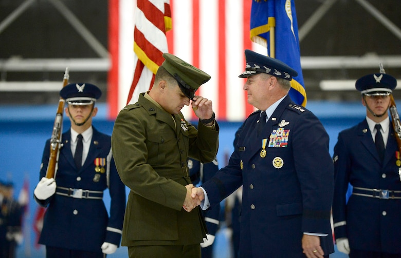 After 40 years of service, Air Force Chief of Staff Gen. Mark A. Welsh III is retired by his son, U.S. Marine Corps 1st Lt. Matthew Welsh, during a ceremony at Joint Base Andrews, Md., June 24, 2016.  Welsh has served as the 20th chief of staff since 2012. (U.S. Air Force photo/Tech. Sgt. Joshua L. DeMotts)