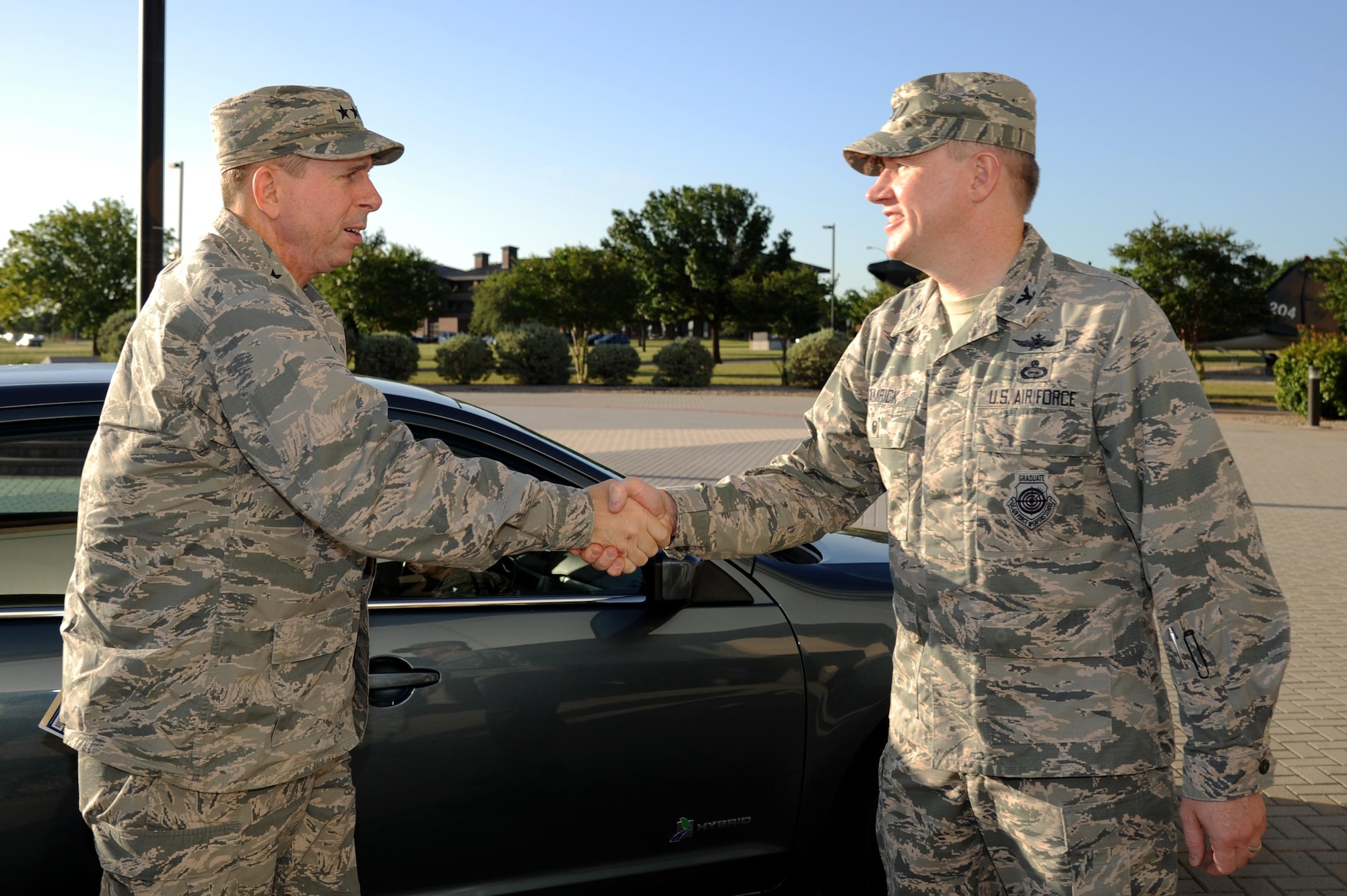 U.S. Air Force Lt. Gen. John Shanahan, director for Defense Intelligence (Warfighter Support), shakes hands with Col. Terry Hamrick Jr., 17th Training Wing Vice Commander, at the Norma Brown Building on Goodfellow Air Force Base, Texas, June 23, 2016. Shanahan came to Goodfellow as the keynote speaker the Intelligence, Surveillance and Reconnaissance 300 Course. (U.S. Air force photo by Senior Airman Joshua Edwards/Released)