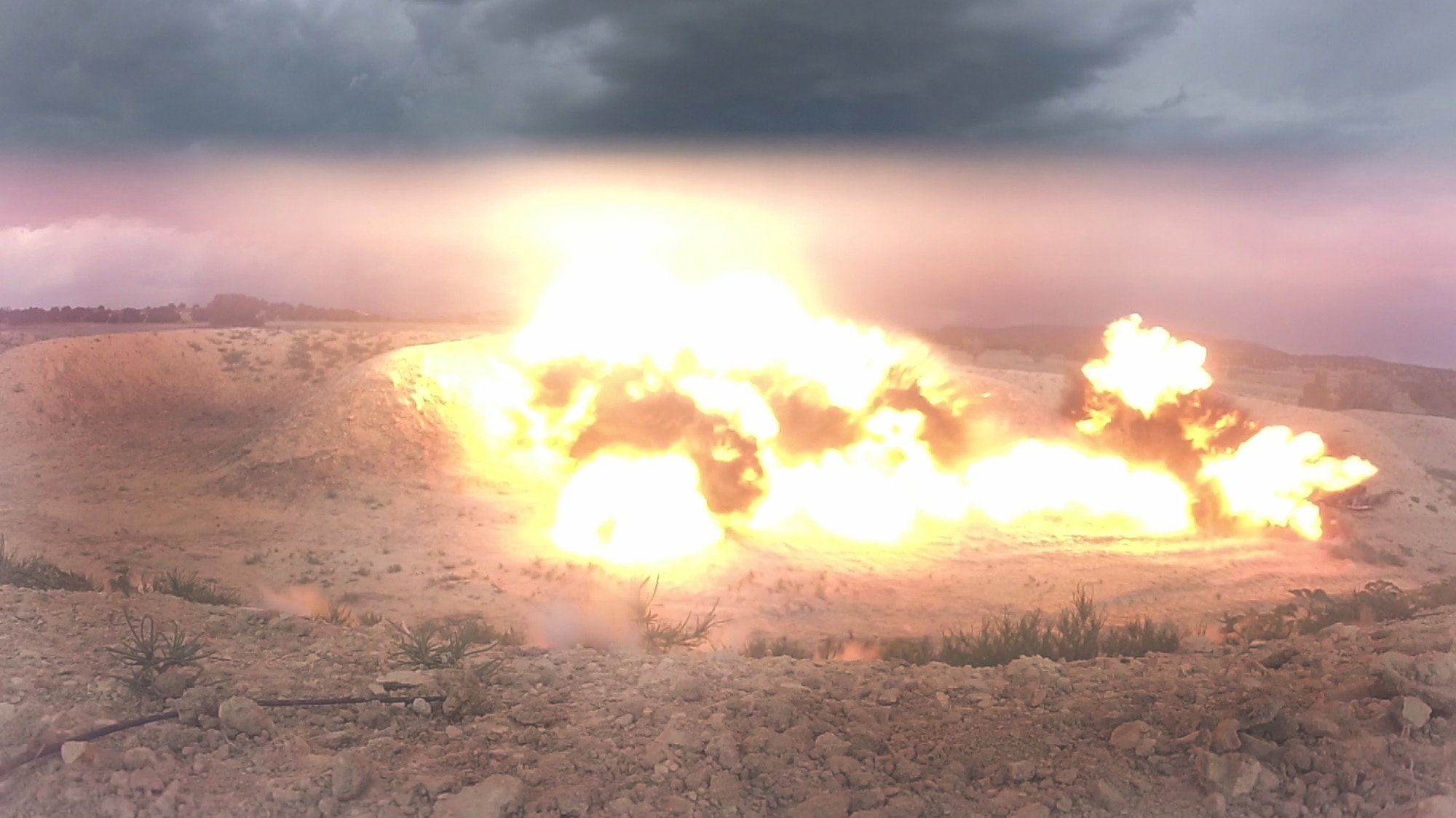 Detonation of three charges by 140th Explosives Ordnance Disposal results in a huge fireball June 23, 2016, at the Airburst Range on Fort Carson, Colo. The detonation shook the ground for hundreds of feet and could be heard miles away. (U.S. Air Force photo by Airman 1st Class Luke W. Nowakowski/Released)
