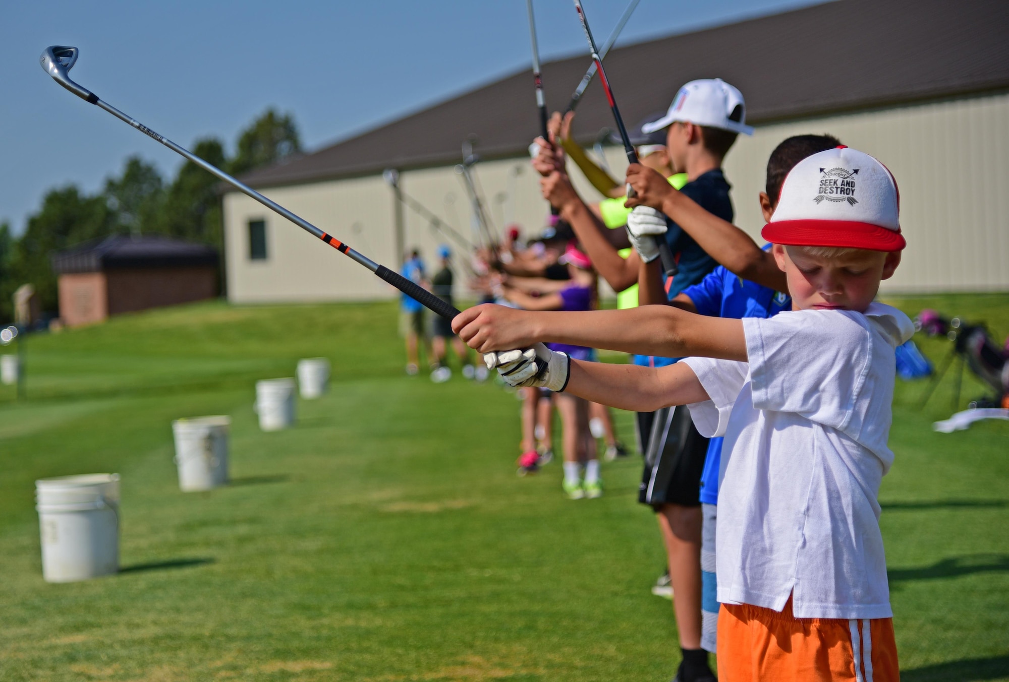 PETERSON AIR FORCE BASE Colo. - Chase Lattemore concentrates on his form as he takes part in the Junior Golf Clinic offered at the Silver Spruce Golf Course on Peterson Air Force Base Colo., June 22, 2016. The five-day clinic focused on addressing particular aspects of the sport in order to significantly improve the student’s game.  (U.S. Air Force photo by Staff Sgt. Amber Grimm)