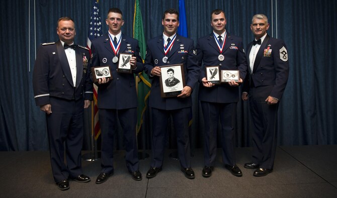 Airmen of Airman Leadership School Class 16 Echo, who earned top honors, pose for a photo with Col. Brian McDaniel, 92nd Air Refueling Wing commander, and Chief Master Sgt. Christian Pugh, 92nd ARW command chief, June 23, 2016, at Fairchild Air Force Base, Washington. ALS is a five-week course that focuses on leadership abilities, profession of arms and effective communication in the workplace. (U.S. Air Force photo/Airman 1st Class Sean Campbell)