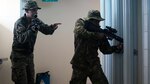 Lance Cpl. Nathan H. Steed demonstrates room-clearing techniques while training with a Papua New Guinean soldier, June 19, 2016, at Taurama Barracks, during Exercise Koa Moana. This is the first exercise for U.S. Marines and service members of the Papua New Guinea Defence Force. The exercise is designed to increase interoperability and relations by sharing infantry, engineering, law enforcement and medical skills. Steed, from Pagosa Springs, Colorado, is an infantryman with Task Force Koa Moana, originally assigned to Alpha Company, 1st Battalion, 1st Marine Regiment, 1st Marine Division, I Marine Expeditionary Force. 