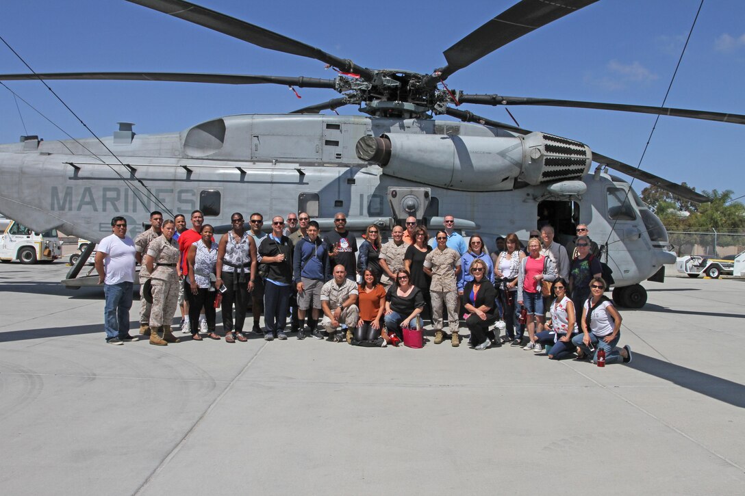 Recruiting Station Los Angeles Marines and more than 30 high school educators from Los Angeles pose for a photo during their tour on the flight line at Marine Corps Air Station Miramar, June 15, 2016, as part of RS Los Angeles’ Educators Workshop. High school educators, consisting of teachers, coaches, and counselors from Los Angeles took part in joint educators workshop with Recruiting Stations San Diego and San Francisco. The workshop was a week-long, June 13-17, event in San Diego where educators got an opportunity to see recruit training firsthand, talk with Marine Corps drill instructors, and recruits in training, and was able to talk to active-duty Marines while aboard a Marine Corps installation. Thirty-one educators from the Los Angeles area made the annual trip. Each visit lasts one week, and participants also experience life on Marine Corps Base Camp Pendleton and Marine Corps Airs Station Miramar. (U.S. Marine Corps photo by Staff Sgt. Alicia R. Leaders/Released)