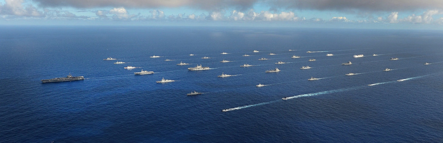 In this file photo, Forty-two ships and submarines representing 15 international partner nations steam in close formation during exercise Rim of the Pacific (RIMPAC) 2014. 