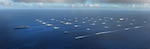 In this file photo, Forty-two ships and submarines representing 15 international partner nations steam in close formation during exercise Rim of the Pacific (RIMPAC) 2014. 