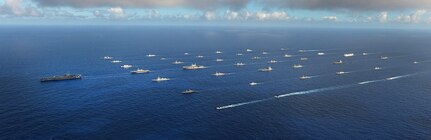 In this file photo, Forty-two ships and submarines representing 15 international partner nations steam in close formation during exercise Rim of the Pacific (RIMPAC) 2014. 