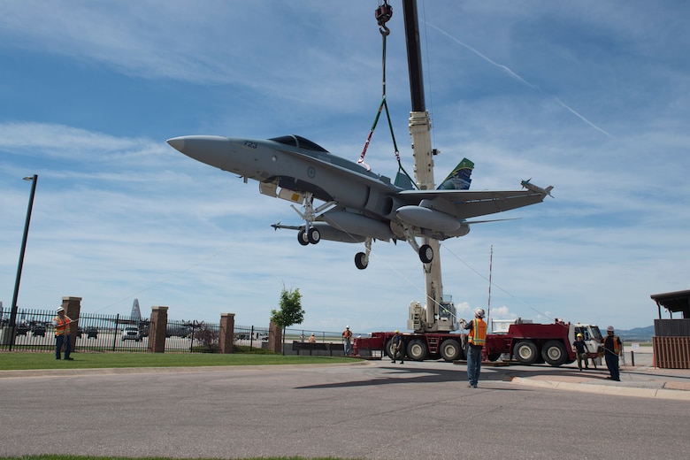 PETERSON AIR FORCE BASE, Colo. – A donated CF-188A Hornet is transported to the Peterson Air Force Base Museum Air Park prior to a dedication ceremony June 24, 2016. The aircraft (tail number 188723) was donated by the Government of Canada to the USAF Heritage Program as a gesture of appreciation for the U.S. and Canada’s longstanding and continued partnership through the North American Aerospace Defense Command. (courtesy photo)