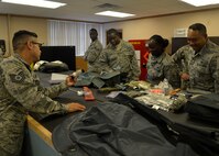 Tech. Sgt. Ronald Johnson, 56th Operations Support Squadron aircrew flight equipment consolidated maintenance technician, shows the Immersion Program participants parts that go in a parachute bag June 24, 2016 at Luke Air Force Base, Ariz. The Immersion Program gives Airmen the opportunity to experience the Air Force from a different perspective. (U.S. Air Force photo by Senior Airman Devante Williams)