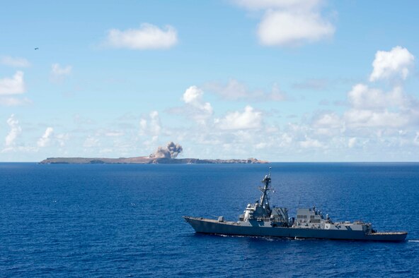 A U.S. Air Force B-52 Stratofortress bomber assigned to the 69th Expeditionary Bomb Squadron from Andersen Air Force Base, Guam, drops a bomb on a targeting island during a joint-service targeting and bombing exercise as the U.S. Navy USS Spruance (DDG 111) guided missile destroyer steams in the Pacific Ocean, June 15, 2016.  In support of the U.S. Pacific Command’s continuous bomber presence operations, the rotation of aircraft in designed to demonstrate U.S. commitment to the Indo-Asia-Pacific Region and enhance regional security. (U.S. Navy photo by Petty Officer 2nd Class Will Gaskill/Released)