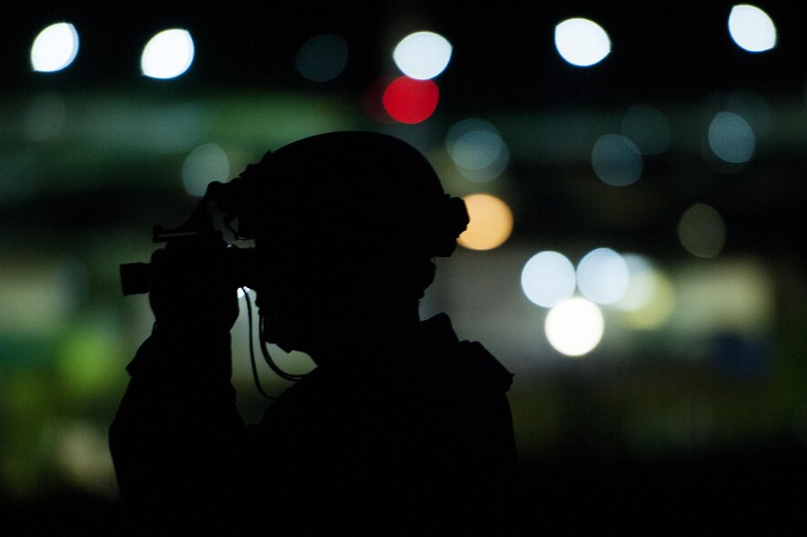U.S. Air Force Tech. Sgt. Johnathan Silsley, 921st Contingency Response Squadron engineer assistant adjusts his night vision goggles before driving an all-terrain vehicle during Exercise Swift Response 16 at Hohenfels Training Area, Germany, June 16, 2016. Exercise SR16 is one of the premier military crisis response training events for multinational airborne forces in the world, the exercise has more than 5,000 participants from 10 NATO nations. (U.S. Air Force photo by Master Sgt. Joseph Swafford/Released) 