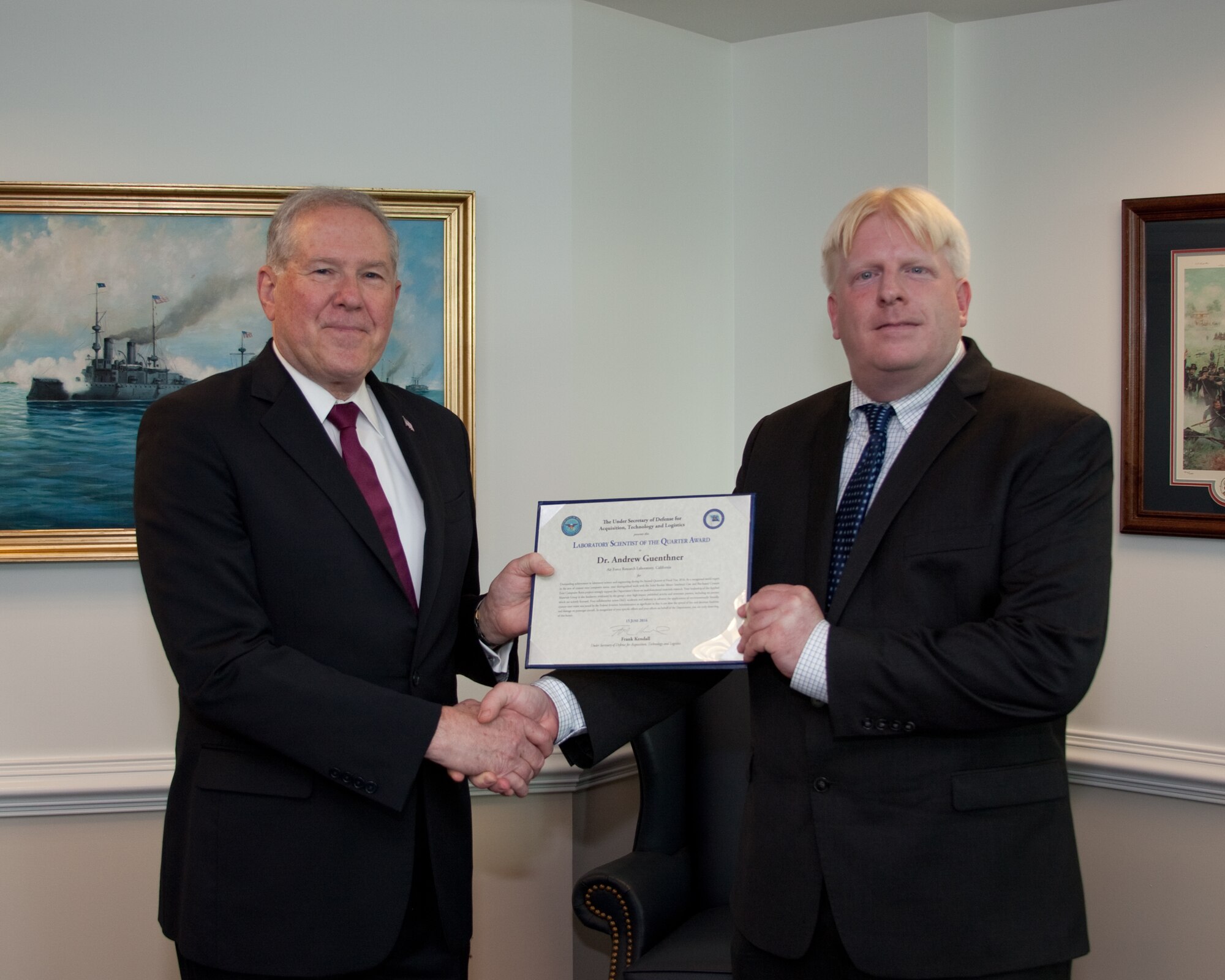 The Honorable Frank Kendall (left), undersecretary of defense for Acquisition, Technology and Logistics, honors Dr. Andrew Guenthner, of the Air Force Research Laboratory, with the department's Scientist of the Quarter Award for the second quarter of 2016. (Courtesy photo)