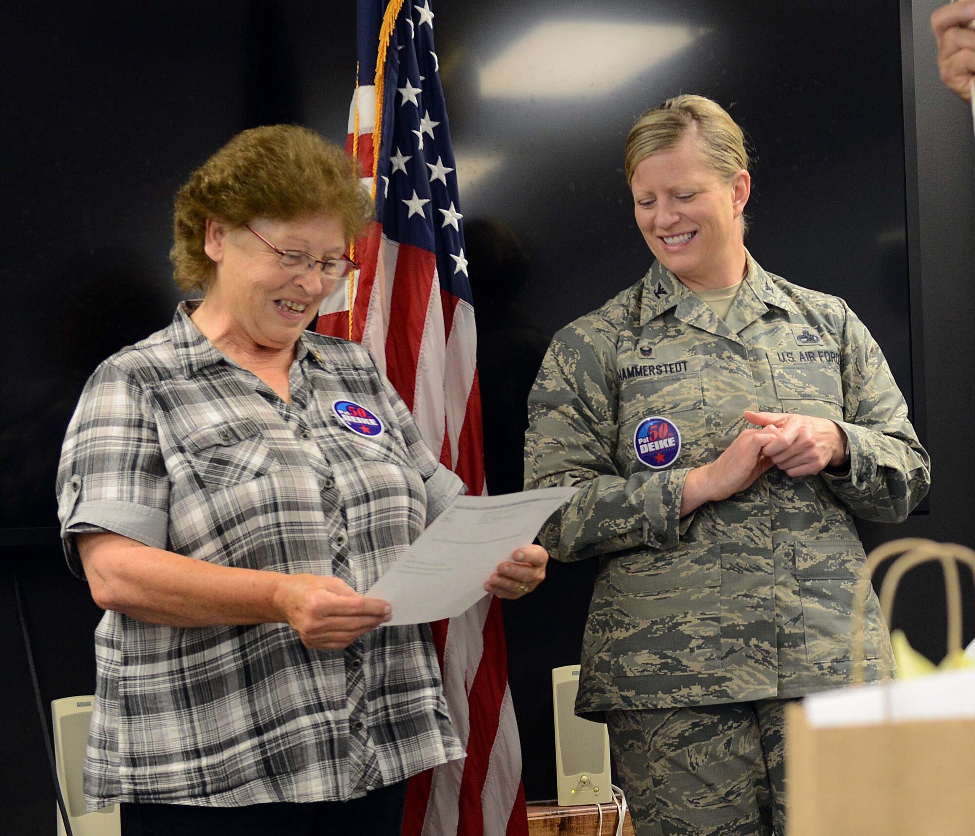 Pat Deike, a 402nd Aircraft Maintenance Group mechanical engineering technician, receives a 50 year service award from Col. Jennifer Hammerstedt, then 402nd AMXG commander. (U.S. Air Force photo by Tommie Horton)