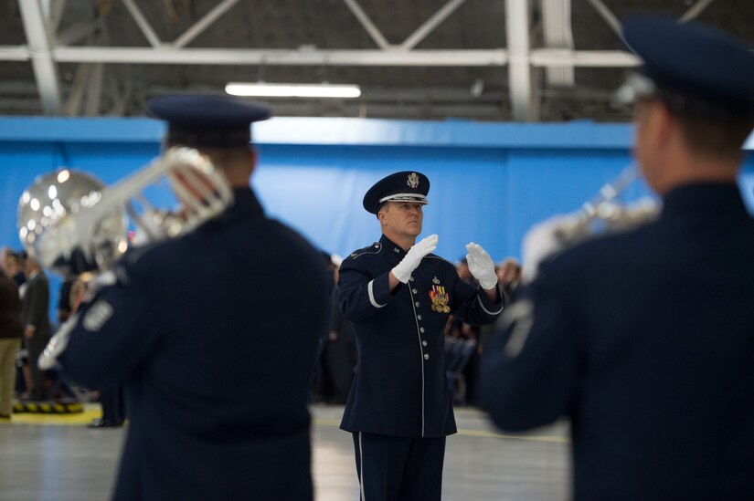 Col. Larry Lang, U.S Air Force Band commander/conductor, leads the band during a performance for the retirement ceremony of Air Force Chief of Staff Gen. Mark Welsh III at Joint Base Andrews, Md., June 24 2016. Welsh retired effective July 1, 2016 after 40 years of honorable military service with military leaders, personnel, friends and family attending the ceremony. (U.S. Air Force photo by Airman 1st Class Rustie Kramer)