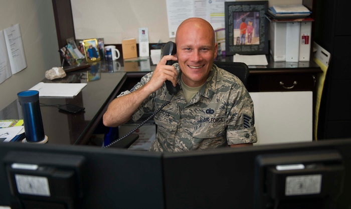 Tech. Sgt. Christopher Cross, 628th Air Base Wing executive support non-commissioned officer, on the phone June 14, 2016, at Joint Base Charleston, S.C. Cross plans to visit a vineyard in Landrum, S.C. for the 4th of July. Cross said Independence Day is a good day to reflect on what American forefathers have done for the freedoms we enjoy. (U.S. Air Force photo/Airman 1st Class Kevin West)