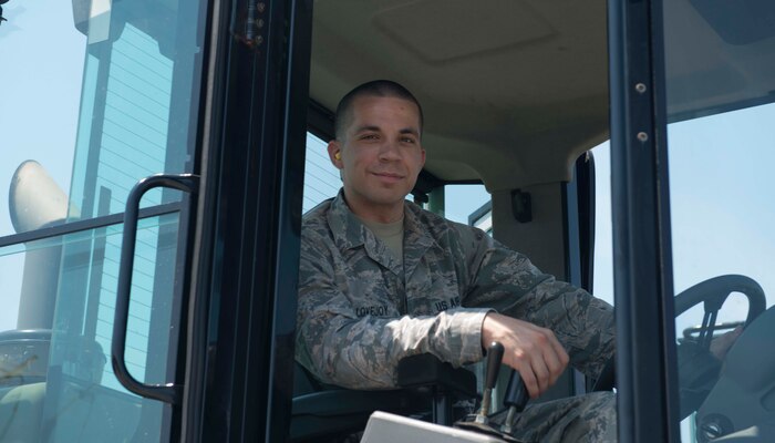 Senior Airman Brett Lovejoy, a 437th Aerial Port Squadron ramp services journeyman, sits in a forklift before heading to the flightline June 22, 2016 at Joint Base Charleston, S.C. Lovejoy is scheduled to work during the 4th of July holiday and as is happy to do so. He said the aerial port here runs 24 hours a day 365 days a year and he is proud to be an Airman in the world’s greatest air force. (U.S. Air Force photo/Airman 1st Class Kevin )