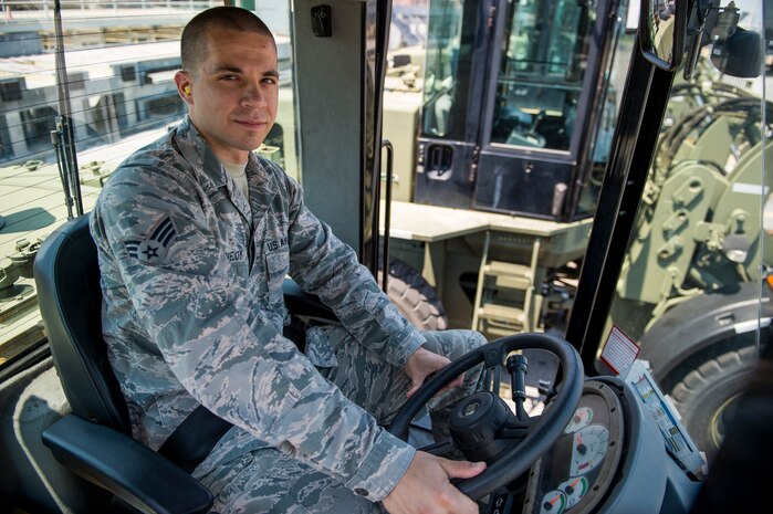 Senior Airman Brett Lovejoy, a 437th Aerial Port Squadron ramp services journeyman, sits in a forklift before heading to the flightline June 22, 2016 at Joint Base Charleston, S.C. Lovejoy is scheduled to work during the 4th of July holiday and as is happy to do so. He said the aerial port here runs 24 hours a day 365 days a year and he is proud to be an Airman in the world’s greatest air force. (U.S. Air Force photo/Staff Sgt. Jared Trimarchi)