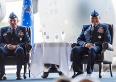 Colonel Jimmy Canlas (right) and Col. John Lamontagne smile during the 437th Airlift Wing change of command June 24, 2016, in Nose Dock 2 at Joint Base Charleston - Air Base, S.C. Canlas, the new 437th AW commander, is a native of Port Hueneme, Calif. He graduated from the University of Texas at San Antonio in 1992 and was commissioned as a Second Lieutenant in the U.S Air Force. A command pilot with more than 4,100 hours in the C-21A, KC-135R Stratotanker and C-17A Globemaster III aircraft, Canlas served as the vice commander, 437th AW, prior to taking command. (U.S. Air Force photo/Staff Sgt. Jared Trimarchi)