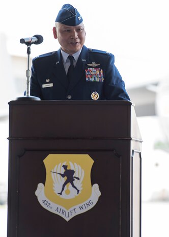 Colonel Jimmy Canlas addresses members of the 437th Airlift Wing and invited guests for his first time as the new commander of the 437th AW June 24, 2016, in Nose Dock 2 at Joint Base Charleston - Air Base, S.C. Canlas, a native of Port Hueneme, Calif., graduated from the University of Texas at San Antonio in 1992 and was commissioned as a Second Lieutenant in the U.S Air Force. A command pilot with more than 4,100 hours in the C-21A, KC-135R Stratotanker and C-17A Globemaster III aircraft, Canlas served as the vice commander, 437th AW, prior to taking command. (U.S. Air Force photo/Staff Sgt. Jared Trimarchi)