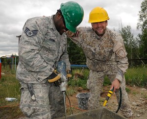 Corporal Anders Bukovskis, Latvian National Armed Forces and Staff Sgt. Jarriel Brown, 127th Civil Engineering Squadron electrical journeymen, work on renovations for a kindergarten in Silmala, Latvia on June 18, 2016. The school’s renovations are part of a Humanitarian-Civic Assistance project. The project provides training opportunities for the United States and Latvian soldiers as well as a benefit for the local community. (U.S. Air National Guard photo by Senior Airman Ryan Zeski)