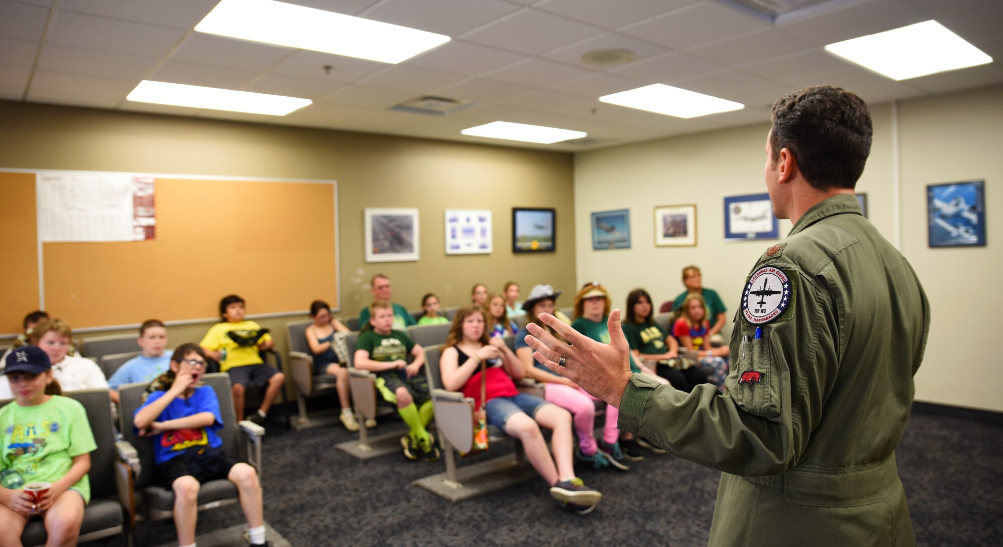 Students of the Alma School District are taught about the remotely piloted aircraft mission from an RPA pilot June 8, 2016, during their tour of the 188th Wing at Ebbing Air National Guard Base, Fort Smith, Ark. The students are part of an Alma School District learning program called Camp Airedale that has a curriculum centered on experience-based activities and uses out-of-classroom and off-campus activities than are available during the typical school year. (U.S. Air National Guard photo by Senior Airman Cody Martin/Released)