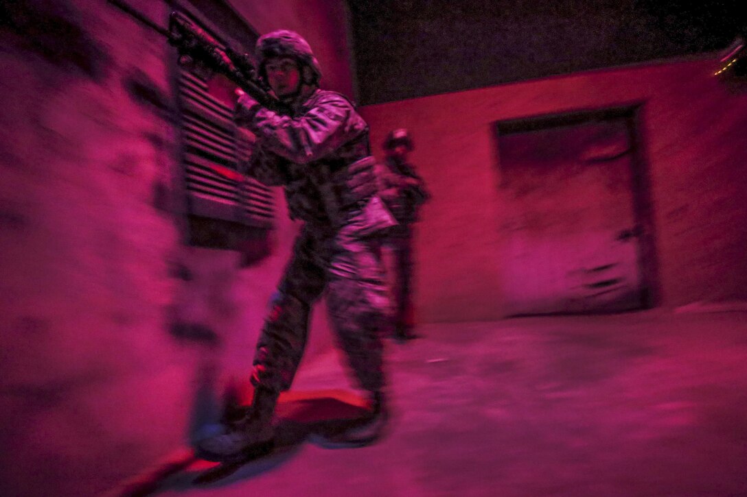 Airmen maneuver through an indoor site for military operations in urban terrain in a New Jersey National Guard training center at Joint Base McGuire-Dix-Lakehurst, N.J., June 16, 2016. Training focused on simulating low-light conditions in an urban environment. Air National Guard photo by Tech. Sgt. Matt Hecht