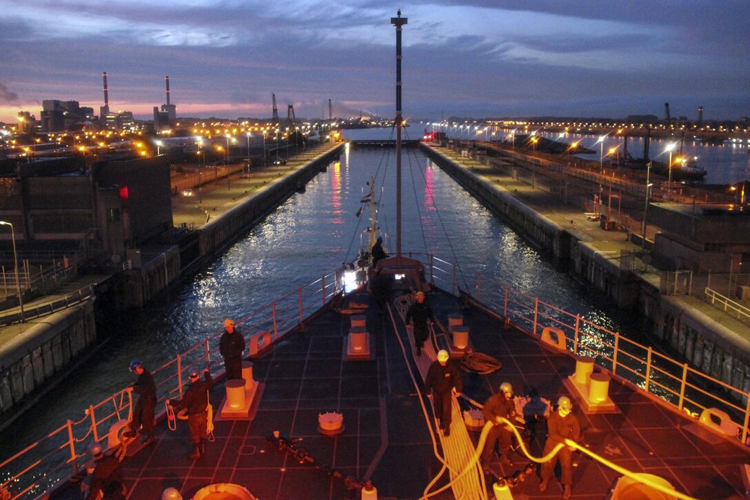 The USS Carter Hall makes its way through the locks of the North Sea Canal en route to Amsterdam June 21, 2016, after participating in the 2016 Baltic Operations exercise. The annual multinational exercise aims to enhance flexibility and interoperability of allied and partner forces in the Baltic region. Navy photo by Seaman Julio Martinez Martinez