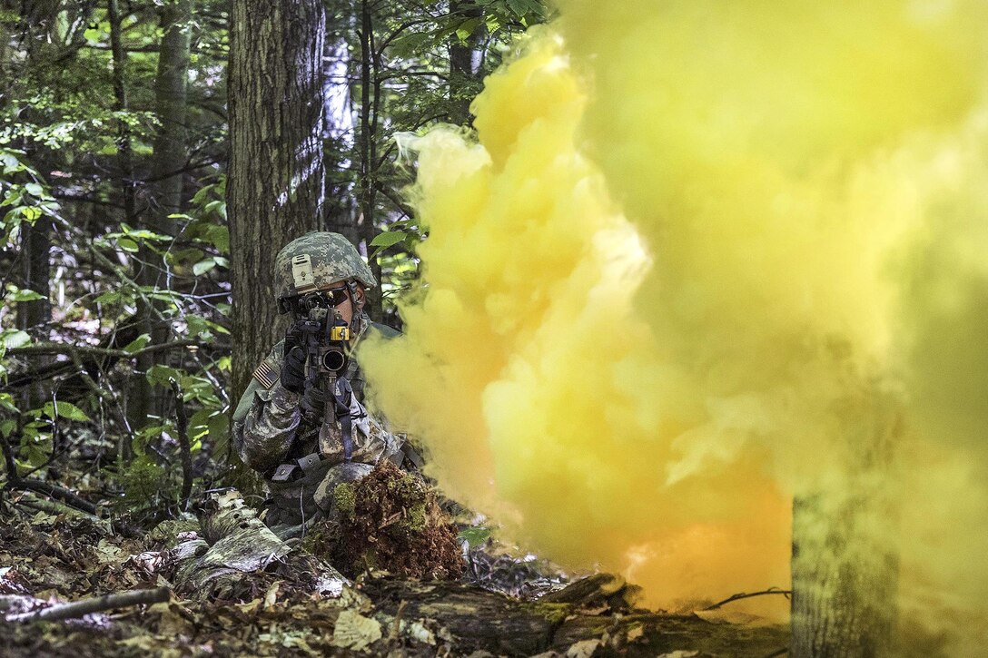 Army Pfc. Saul Hernandez provides security before advancing under the cover of smoke to his next objective during annual training at Camp Ethan Allen Training Site in Jericho, Vt., June 15, 2016. Watkins is assigned to the Vermont National Guard’s Company A, 3rd Battalion, 172nd Infantry Regiment, 86th Infantry Brigade Combat Team (Mountain). Air National Guard photo by Tech. Sgt. Sarah Mattison