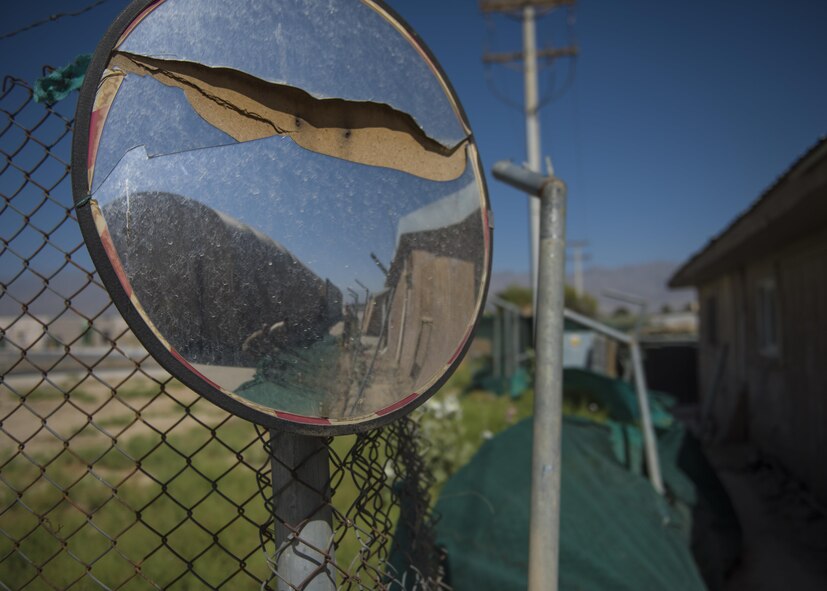 455th Expeditionary Civil Engineer Squadron demolish an old petroleum, oil, and lubricant (POL) building to help consolidate the facilities across the base, June 22, 2016, Bagram Airfield, Afghanistan. Engineers provide necessary problem skills and a wide range of expertise from drafting, surveying and planning to explosive ordnance disposal and disaster preparedness. (U.S. Air Force photo by Senior Airman Justyn M. Freeman)