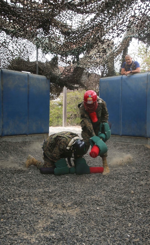 Recruits from India Company, 3rd Recruit Training Battalion, compete against each other during Pugil Sticks III at Marine Corps Recruit Depot San Diego, June 21. Recruits were taught offensive and defensive techniques during Marine Corps Martial Arts Program classes, which included learning bayonet techniques with their rifles. Annually, more than 17,000 males recruited from the Western Recruiting Region are trained at MCRD San Diego. India Company is scheduled to graduate July 15.