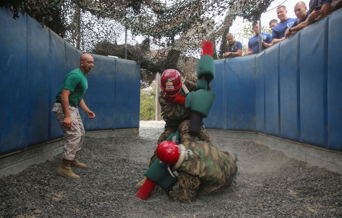 Recruits from India Company, 3rd Recruit Training Battalion, compete against each other during Pugil Sticks III at Marine Corps Recruit Depot San Diego, June 21. Recruits were taught offensive and defensive techniques during Marine Corps Martial Arts Program classes, which included learning bayonet techniques with their rifles. Annually, more than 17,000 males recruited from the Western Recruiting Region are trained at MCRD San Diego. India Company is scheduled to graduate July 15.