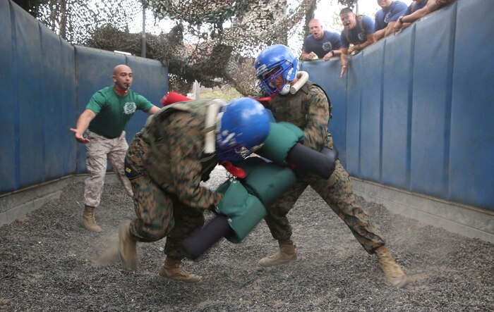 Recruits from India Company, 3rd Recruit Training Battalion, compete against each other during Pugil Sticks III at Marine Corps Recruit Depot San Diego, June 21. The match was won when a recruit delivered multiple body strikes or a single blow to the head. Annually, more than 17,000 males recruited from the Western Recruiting Region are trained at MCRD San Diego. India Company is scheduled to graduate July 15.